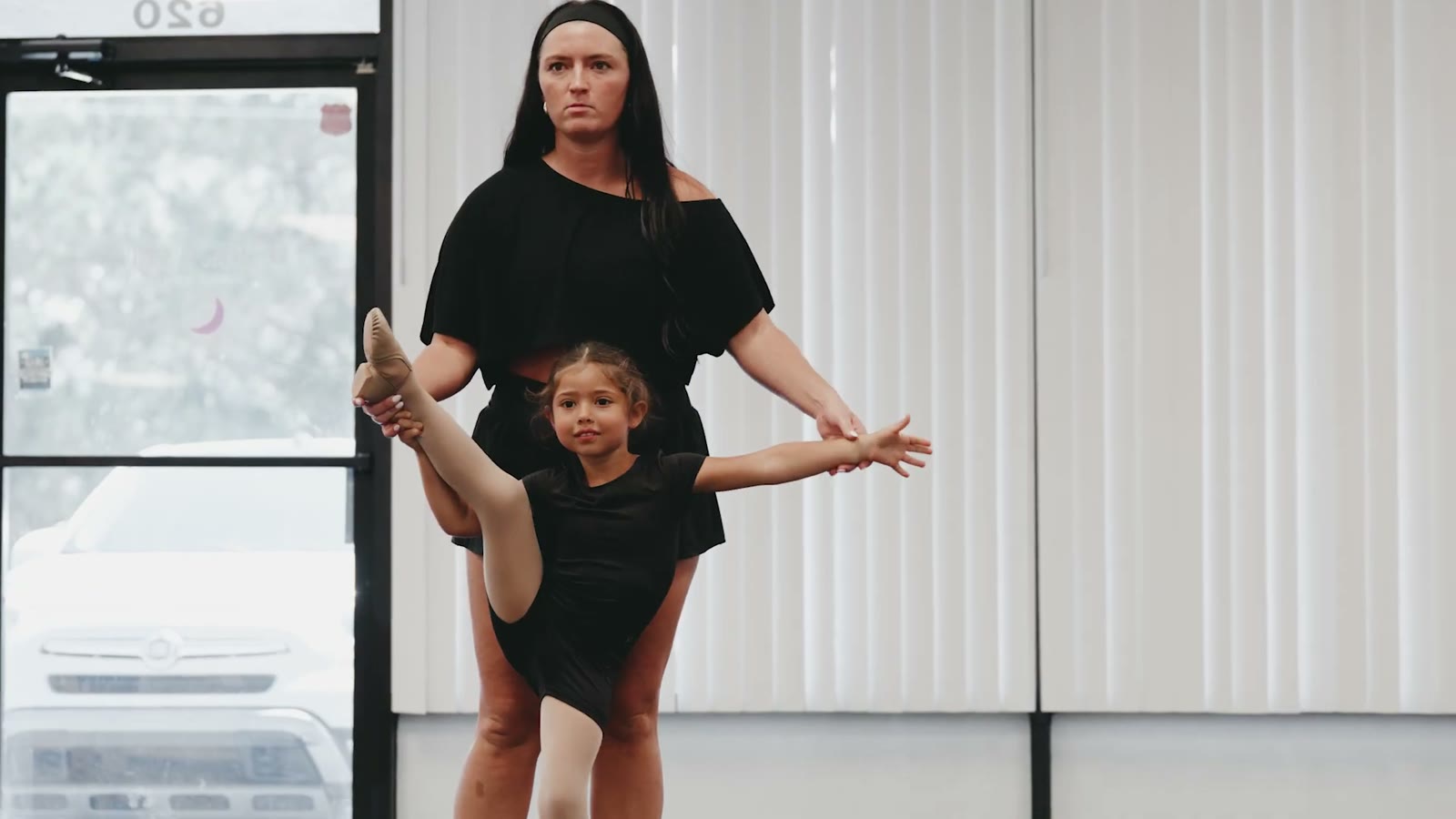 A young Rhythm & Soul dancer practicing with her instructor